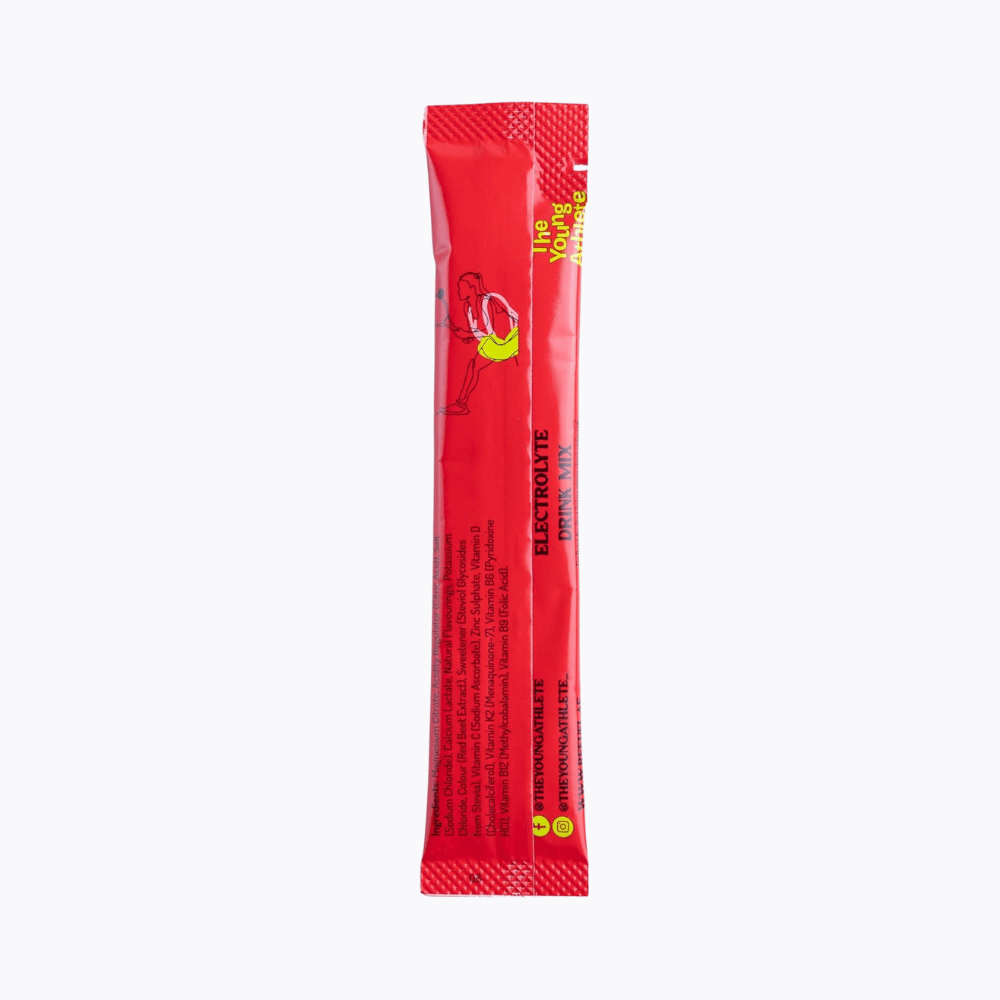 Red electrolyte powder packet on a white background