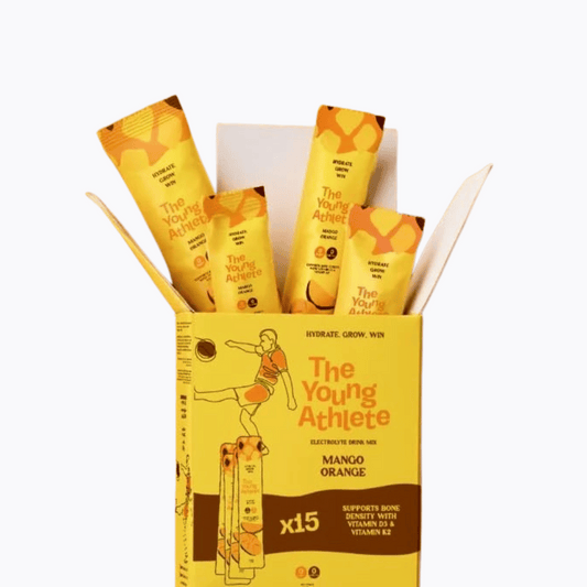 Yellow box of 'The Young Athlete' drink mix with multiple packets on a white background