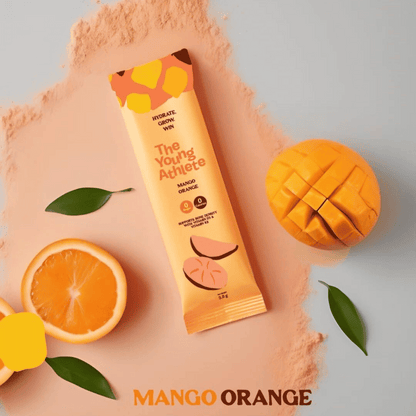 The Young Athlete Mango Orange sports drink mix package with a mango and orange on a peach background.