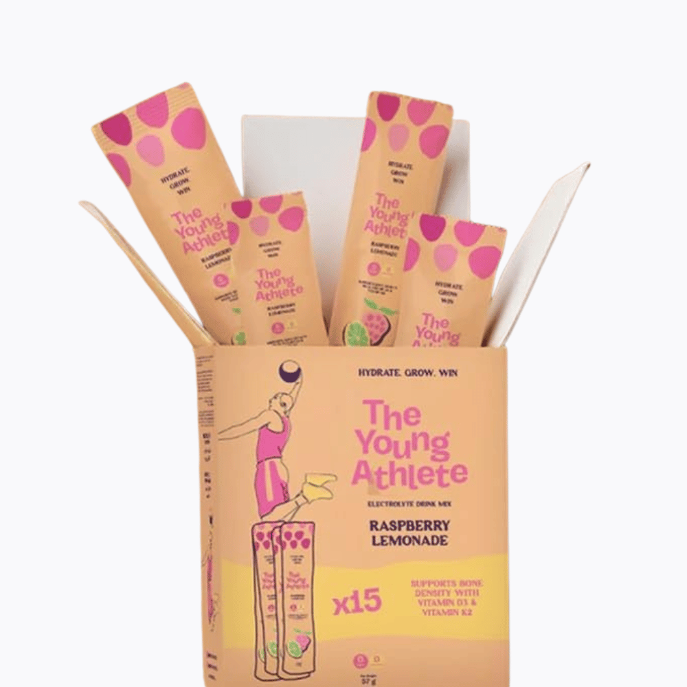 The Young Athlete electrolyte drink mix packaging with pink and yellow design on a white background