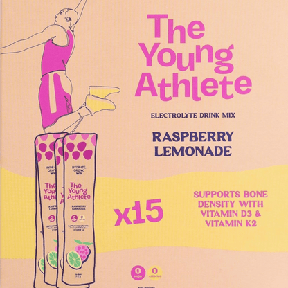 Advertisement for 'The Young Athlete' electrolyte drink mix in raspberry lemonade flavor on a beige background.