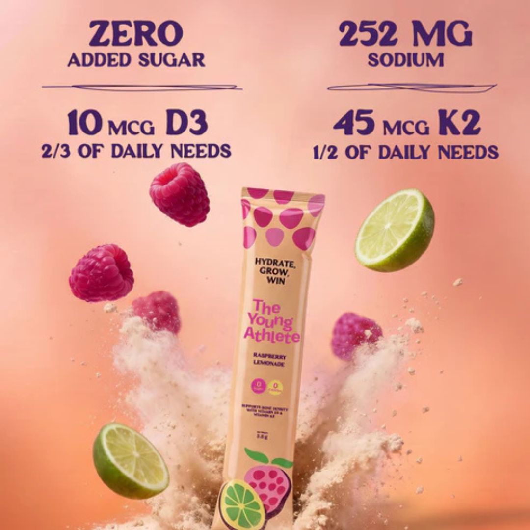 Product packaging with nutritional information and fruit elements on a pink background