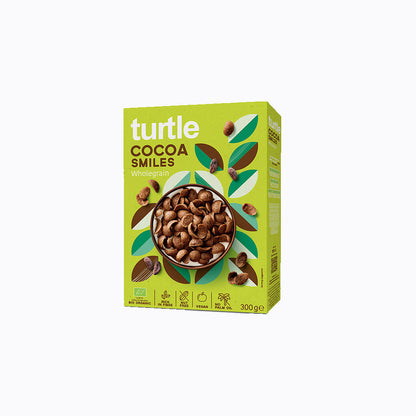 A 300g box of turtle brand Cocoa Smiles Whiskerpip cereal, featuring a bright lime green packaging design with illustrations of cocoa beans and a bowl of cereal in the center.