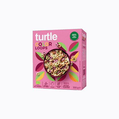 A 300 g box of Turtle Color Loops cereal on a plain white background. The box is predominantly pink with a colorful illustration of leaves and a bowl of multicolored ring cereal.