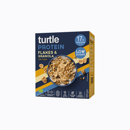 A 300g box of Turtle Protein Flakes & Granola with blue, yellow, and dark gray packaging, featuring a bowl of granola in the center and product details on a white background.