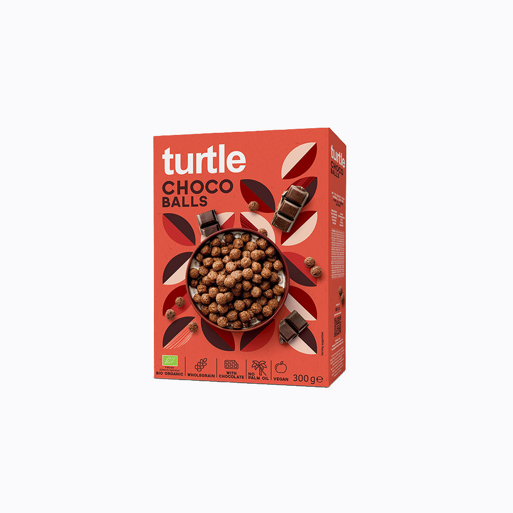 A 300 g box of Turtle Choco Balls cereal on a plain white background. The packaging is predominantly red with brown and cream accents, featuring a bowl of chocolate-coated cereal balls.