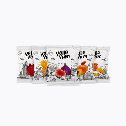 Five Yalla Yum flavor snack pouches arranged in a fan shape on a plain white background. The white packaging features black line art and colorful illustrations of different fruits, including strawberry, fig, apricot, and mango.