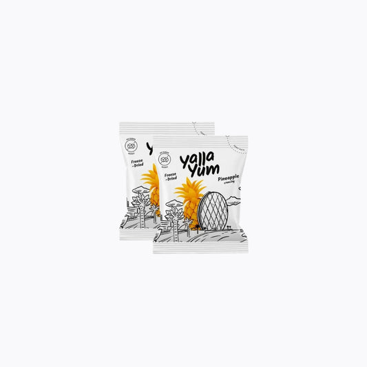 Two Yalla Yum pineapple snack packages on a white background