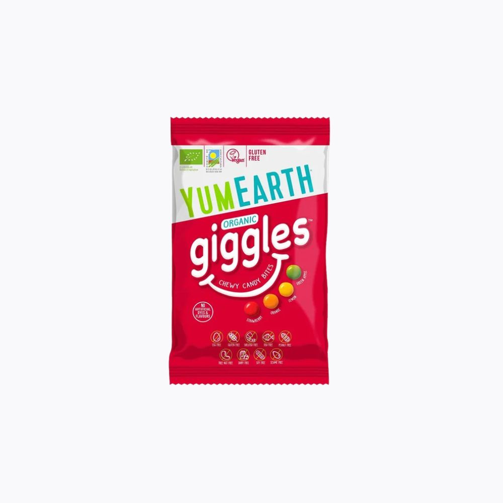 A single packet of YumEarth Organic Giggles Crinkle Candy Bites on a plain white background. The packaging is primarily red with a white band at the top, featuring the brand name 'YumEarth' in green and blue, and 'giggles' in large white text.