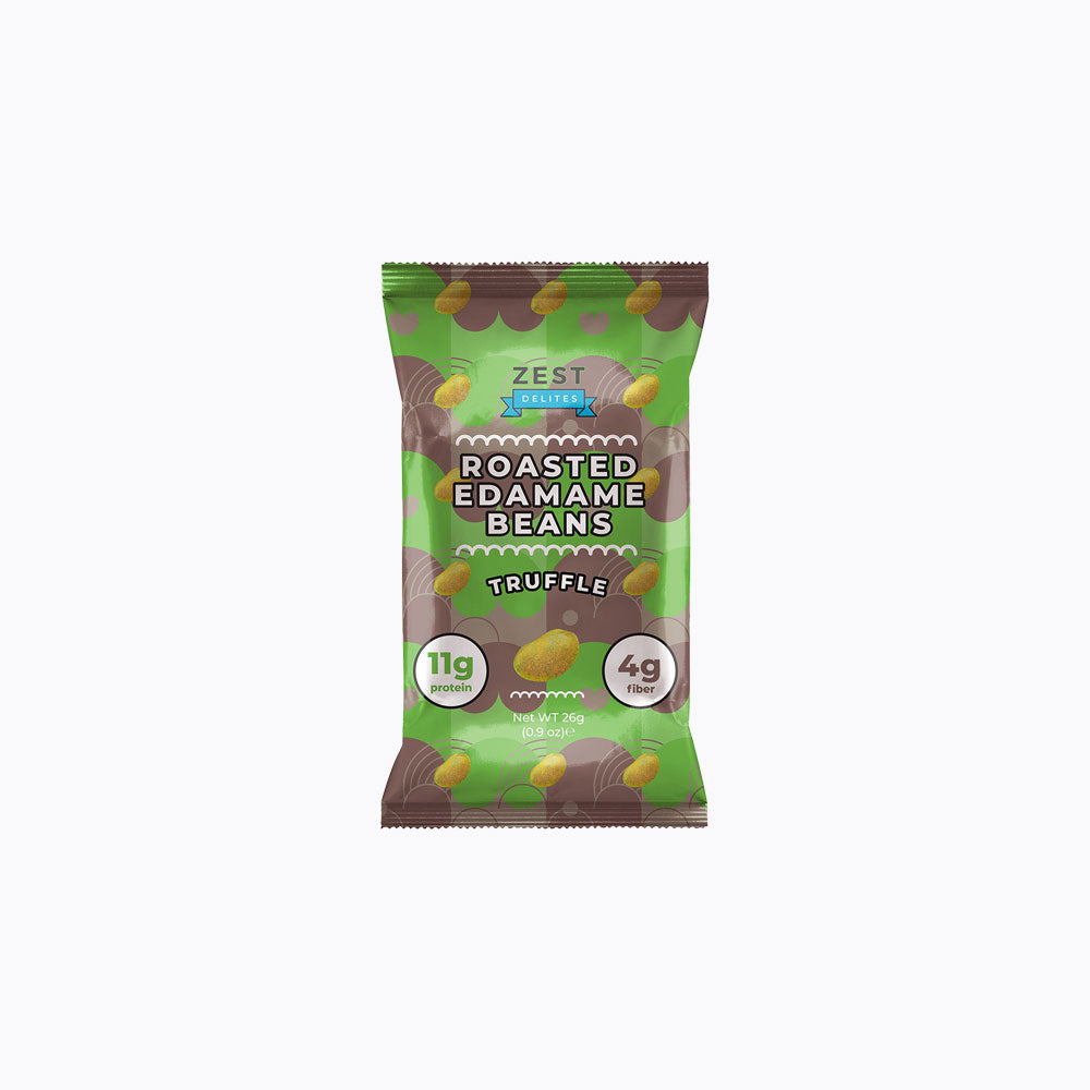 A 24-pack display box of Zest Zestix Mango Apple Based Dried Fruit Bars, featuring multiple individually wrapped bars fanned out from a black cardboard tray with fruit illustrations and a few fresh mangoes and an apple on a white background.